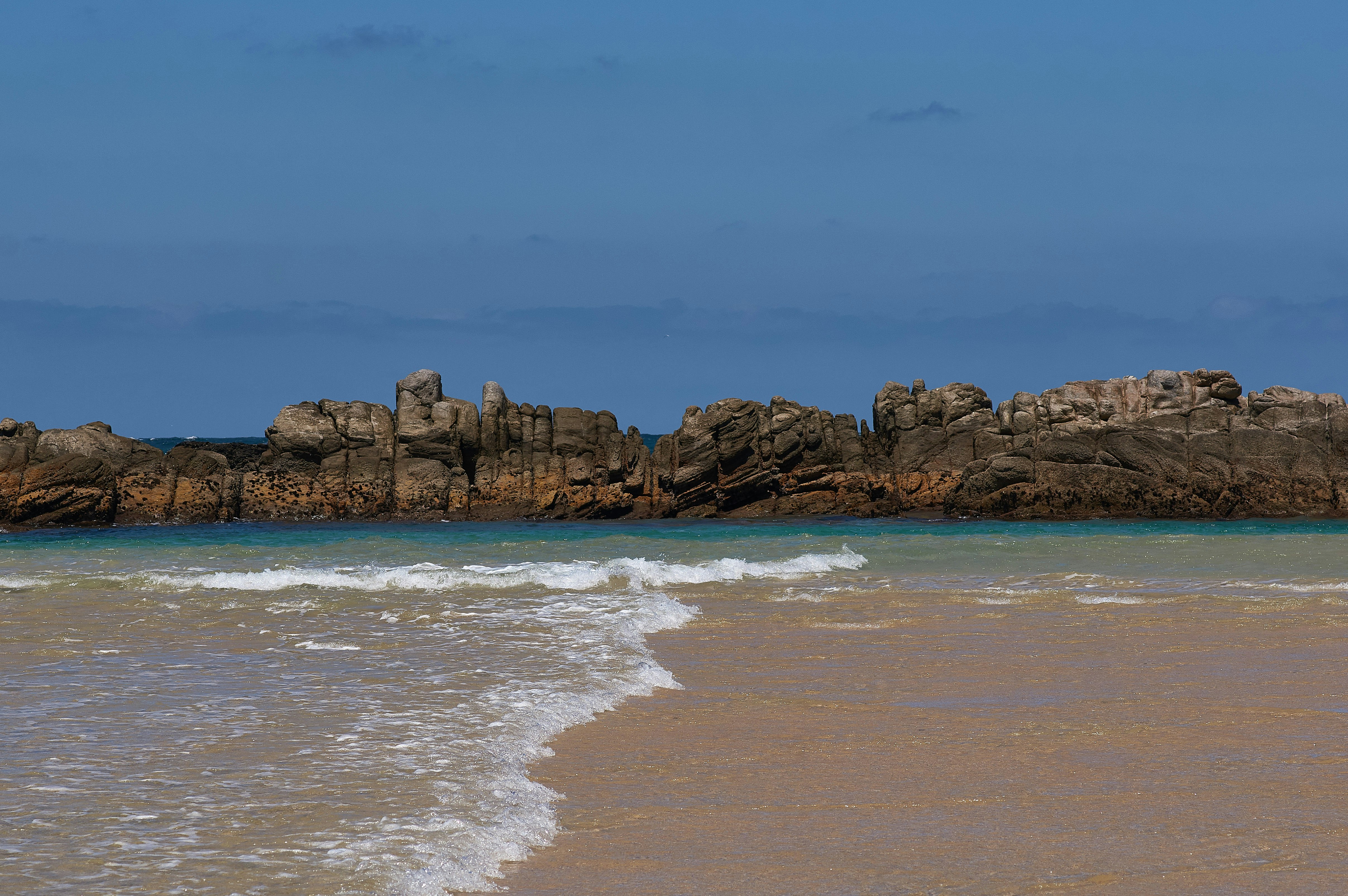 brown sand beach during daytime